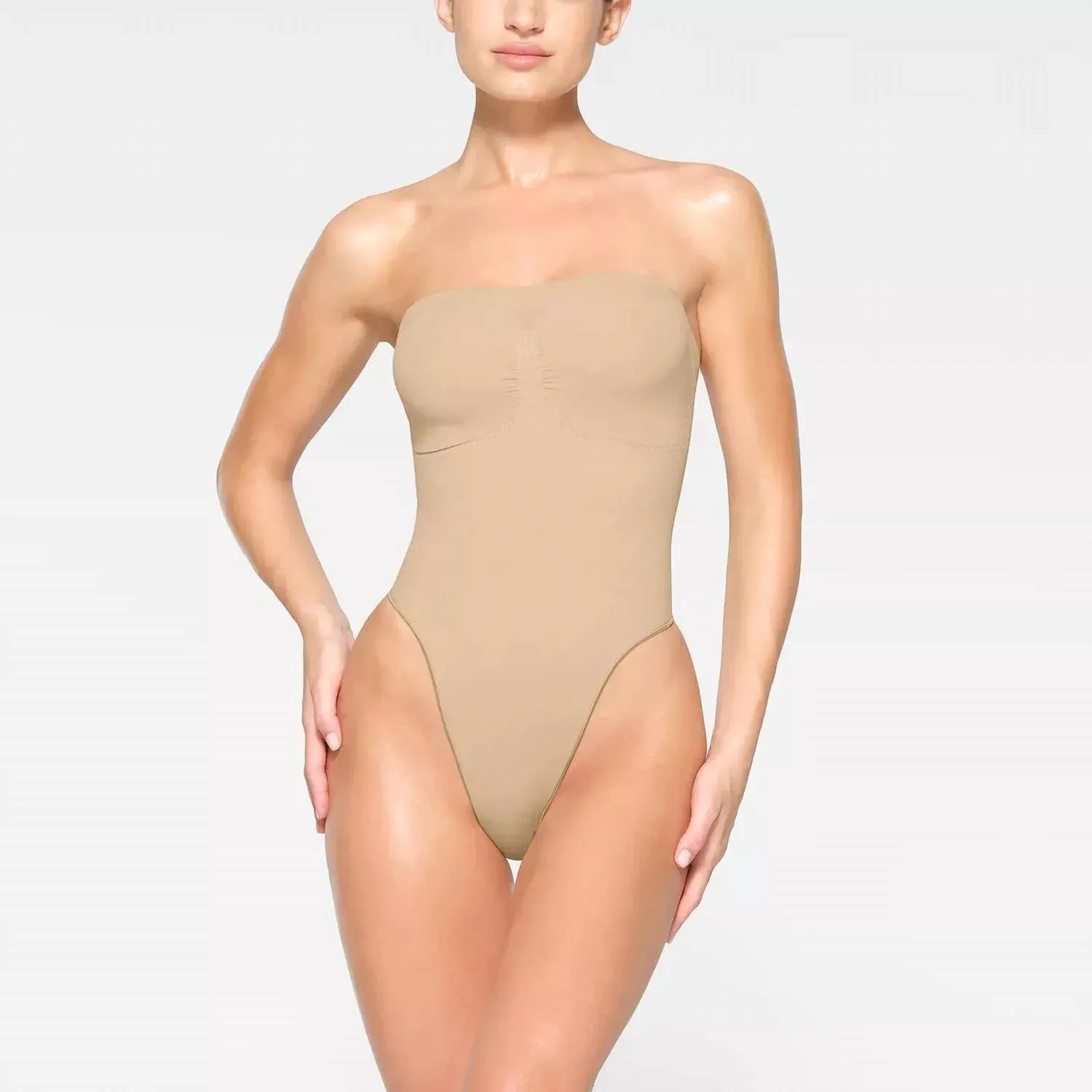 Seamless Sculpt Strapless Thong Bodysuit In Sand