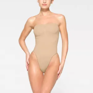 Seamless Sculpt Strapless Thong Bodysuit In Sand